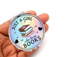 just a girl who loves donuts compact mirror, laying on a woman's hand to show the size.