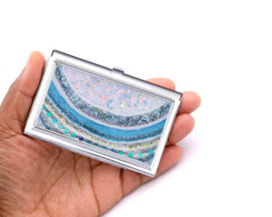 Credit Card Holder Bus112, Laying On A woman's Hand To Show The Size. Designed By Terlis Designs.