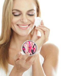 Custom travel handheld mirror being used by a woman applying makeup. Created by Terlis Designs.