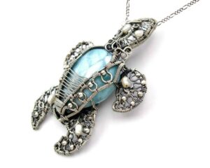 Larimar turtle necklace side view to show wire wrapped details by Terlis Designs.