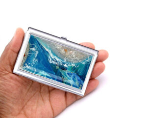 Ocean Art Business Card Holder Bus59, Laying On A woman's Hand To Show The Size. Designed By Terlis Designs.