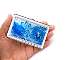 Ocean Art Credit Card Case Bus177, Laying On A woman's Hand To Show The Size. Designed By Terlis Designs.