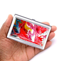 Travel Credit Card Case Bus24, Laying On A woman's Hand To Show The Size. Designed By Terlis Designs.
