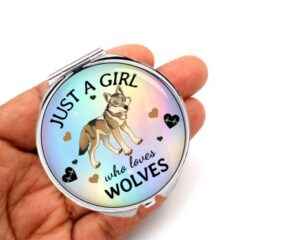 just a girl who loves foxes compact mirror, laying on a woman's hand to show the size.