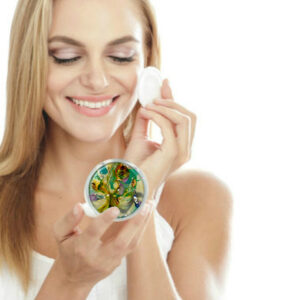 seafoam green Compact mirror being used by a woman applying makeup. Created by Terlis Designs.