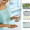 Birth Control Pill Case - PILB162, being used by a woman holding a glass of water and her pills.