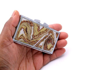 Cute Pill Box - PILB124, laying on a woman's hand to show the size, image by Terlis Designs.