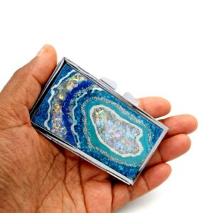 Portable Pill Box - PILB133, laying on a woman's hand to show the size, image by Terlis Designs.