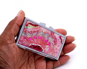 Small Pill Organizer - PILB57, laying on a woman's hand to show the size, image by Terlis Designs.