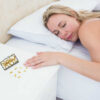Custom Name Birth Control pill dispenser - PILB452, placed on a bedside table, with a woman peacefully sleeping in her bed, by Terlis Designs