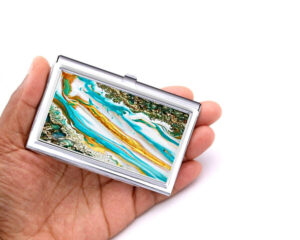 Custom Name metal business card holder - BUS194B - Hand Shot, laying on a woman's hand to show the size, image by Terlis Designs.