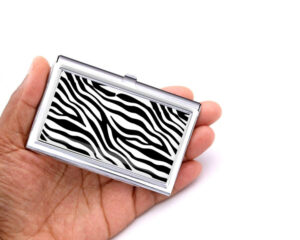 Custom Name metal credit card case - BUS202B - Hand Shot, laying on a woman's hand to show the size, image by Terlis Designs.