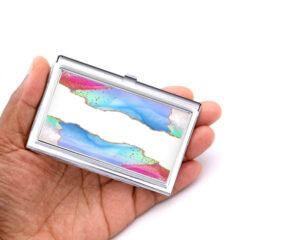 Custom Name silver business card holder - BUS193B - Hand Shot, laying on a woman's hand to show the size, image by Terlis Designs.