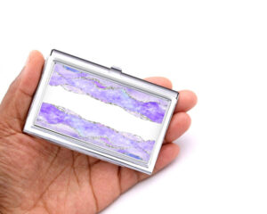 Custom Name stainless steel business card holder - BUS190 - Hand Shot, laying on a woman's hand to show the size, image by Terlis Designs.