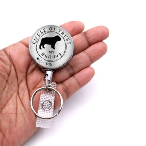 Circle of Trust Nurse pediatrics badge reel - BADR446SIL - laying on a woman's hand to show the size. Designed By Terlis Designs.