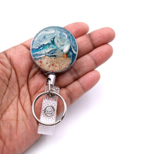 Employee badge holder - BADR136 - laying on a woman's hand to show the size. Designed By Terlis Designs.