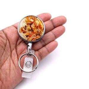 Id key holder - BADR70 - laying on a woman's hand to show the size. Designed By Terlis Designs.