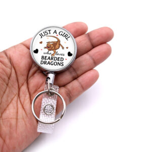 Just A Girl Who Loves Chickens retractable badge reel - BADR419 - laying on a woman's hand to show the size. Designed By Terlis Designs.