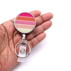 Monogram Initial retractable badge reel - BADR439 - laying on a woman's hand to show the size. Designed By Terlis Designs.