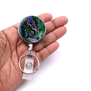 Nurse pediatrics badge reel - BADR339 - laying on a woman's hand to show the size. Designed By Terlis Designs.
