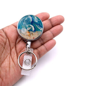 Nursing badge holder - BADR152 - laying on a woman's hand to show the size. Designed By Terlis Designs.