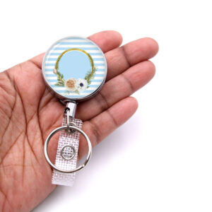Pastel Stripe medical badge reel - BADR472B - laying on a woman's hand to show the size. Designed By Terlis Designs.