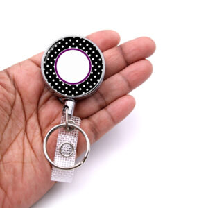Polka Dot Art Id name tag holder - BADR467B - laying on a woman's hand to show the size. Designed By Terlis Designs.