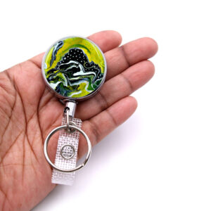 Teacher badge holder - BADR137 - laying on a woman's hand to show the size. Designed By Terlis Designs.