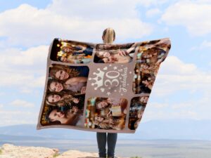 30th Birthday Custom Photo Collage Blanket With Pictures - BLANRM1, showing a lady camping outdoors wearing the plush blanket over her shoulders.