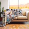 Custom Anniversary Collage Photo Blanket - BLANAI1, laying over the back and seat of a plush beige sofa. Image by Terlis Designs.
