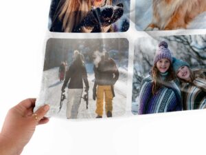 Custom Family Photo Collage Blanket - BLANAJ1, closeup view of the blanket held between the thumbs and fingers.