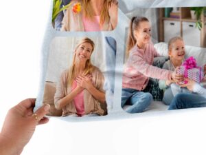 Custom Mom Birthday Photo Collage Blanket - BLANAK1, closeup view of the blanket held between the thumbs and fingers.