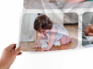 Custom Photo Collage Birthday Blanket - BLANO2, closeup view of the blanket held between the thumbs and fingers.