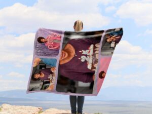 Family Photo Collage Blanket With Pictures - BLANO1, showing a lady camping outdoors wearing the plush blanket over her shoulders.