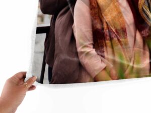 Family Photo Collage Personalized Memorial Blanket - BLANA1, closeup view of the blanket held between the thumbs and fingers.