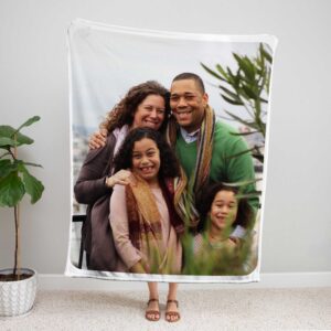Family Photo Collage Personalized Memorial Blanket - BLANA1, showing a lady standing upright, holding the blanket above her head to show the full design.