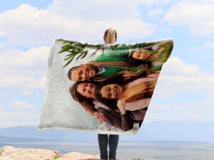 Family Photo Collage Personalized Memorial Blanket - BLANA1, showing a lady camping outdoors wearing the plush blanket over her shoulders.