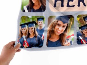Personalized Graduation Photo Collage Blanket - BLANAM1, closeup view of the blanket held between the thumbs and fingers.