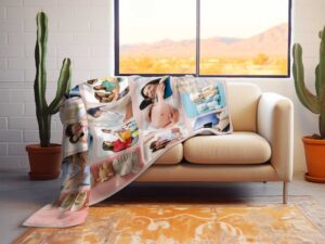 Personalized Newborn Photo Collage Blanket - BLANAN1, laying over the back and seat of a plush beige sofa. Image by Terlis Designs.
