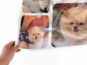Personalized Pet Picture Throw Blanket - BLANAK2, closeup view of the blanket held between the thumbs and fingers.