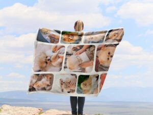 Personalized Pet Picture Throw Blanket - BLANAK2, showing a lady camping outdoors wearing the plush blanket over her shoulders.
